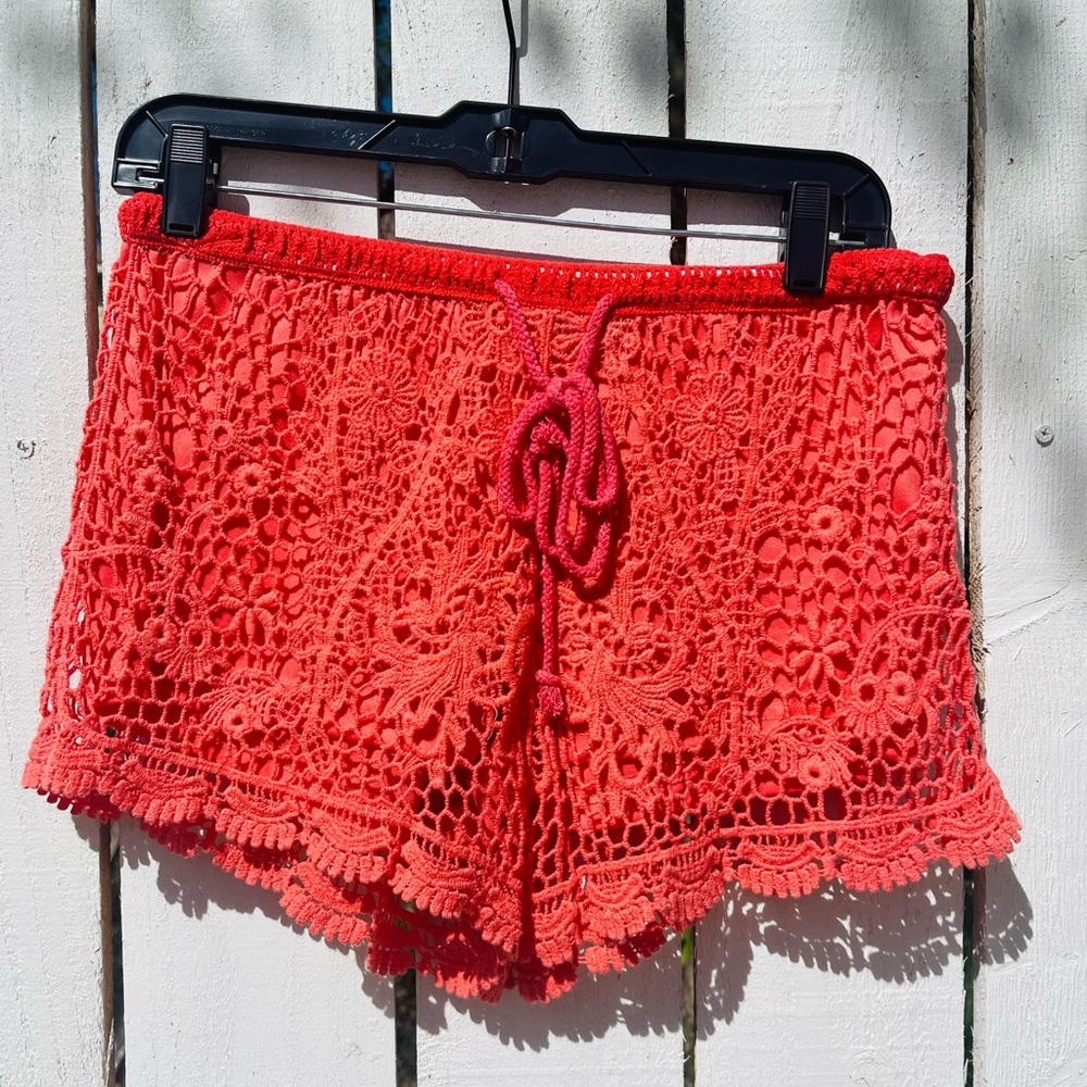 Orange floral detailed shorts.